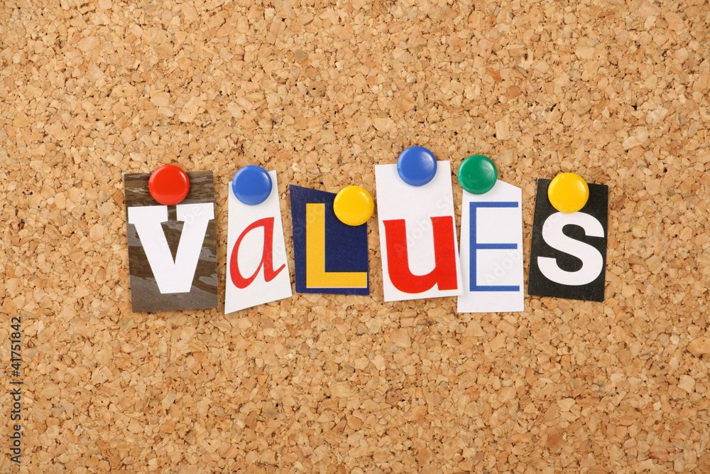 The word values in letters pinned to a cork board